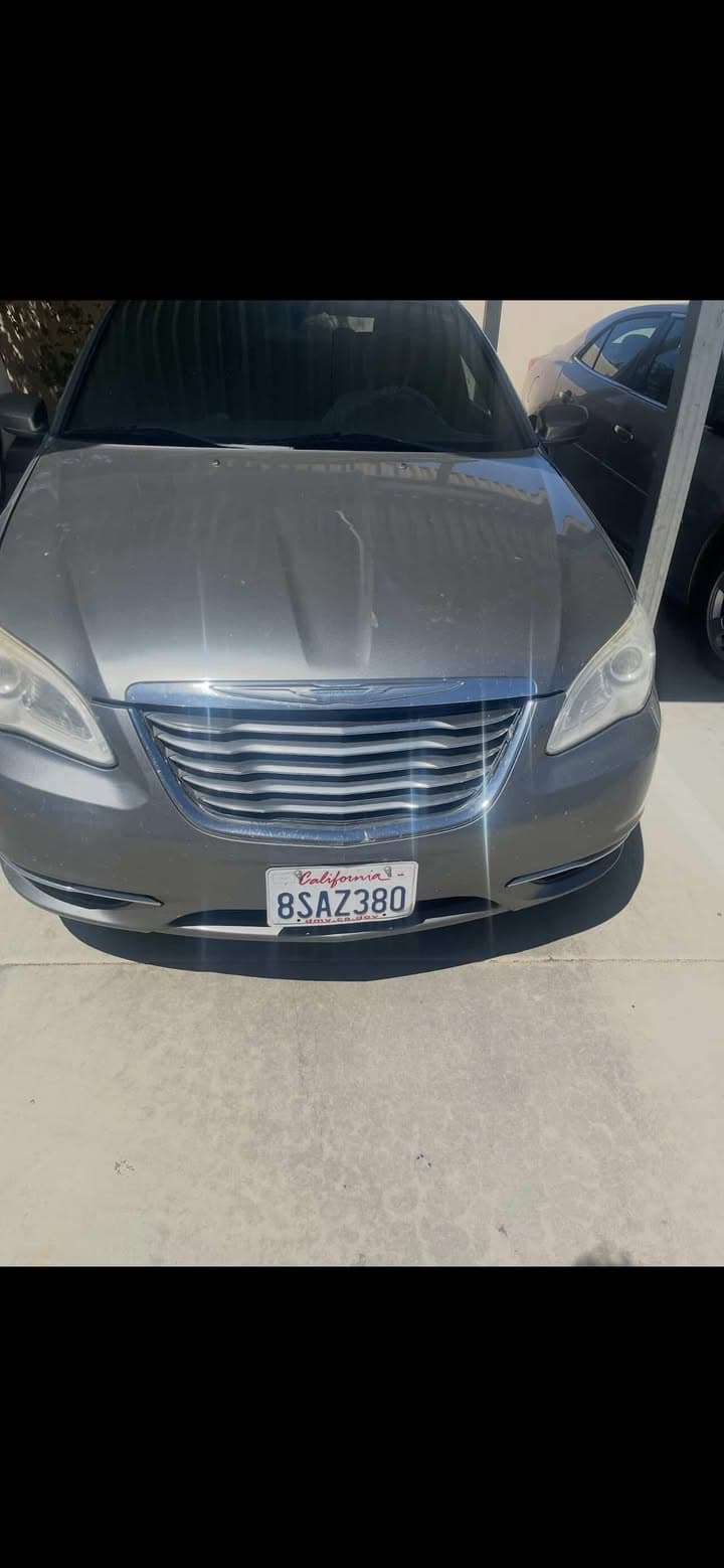 STOLEN Chrysler 200 has dents on both sides. Plate #8SAZ380. Taken from...