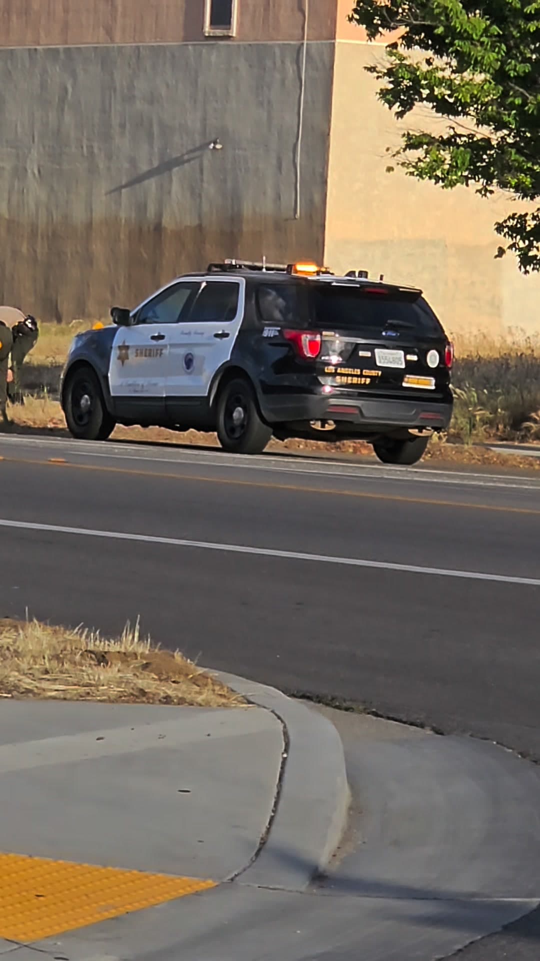 273.5....750 East Avenue Q....male black wearing white shirt and gray pants hitting...