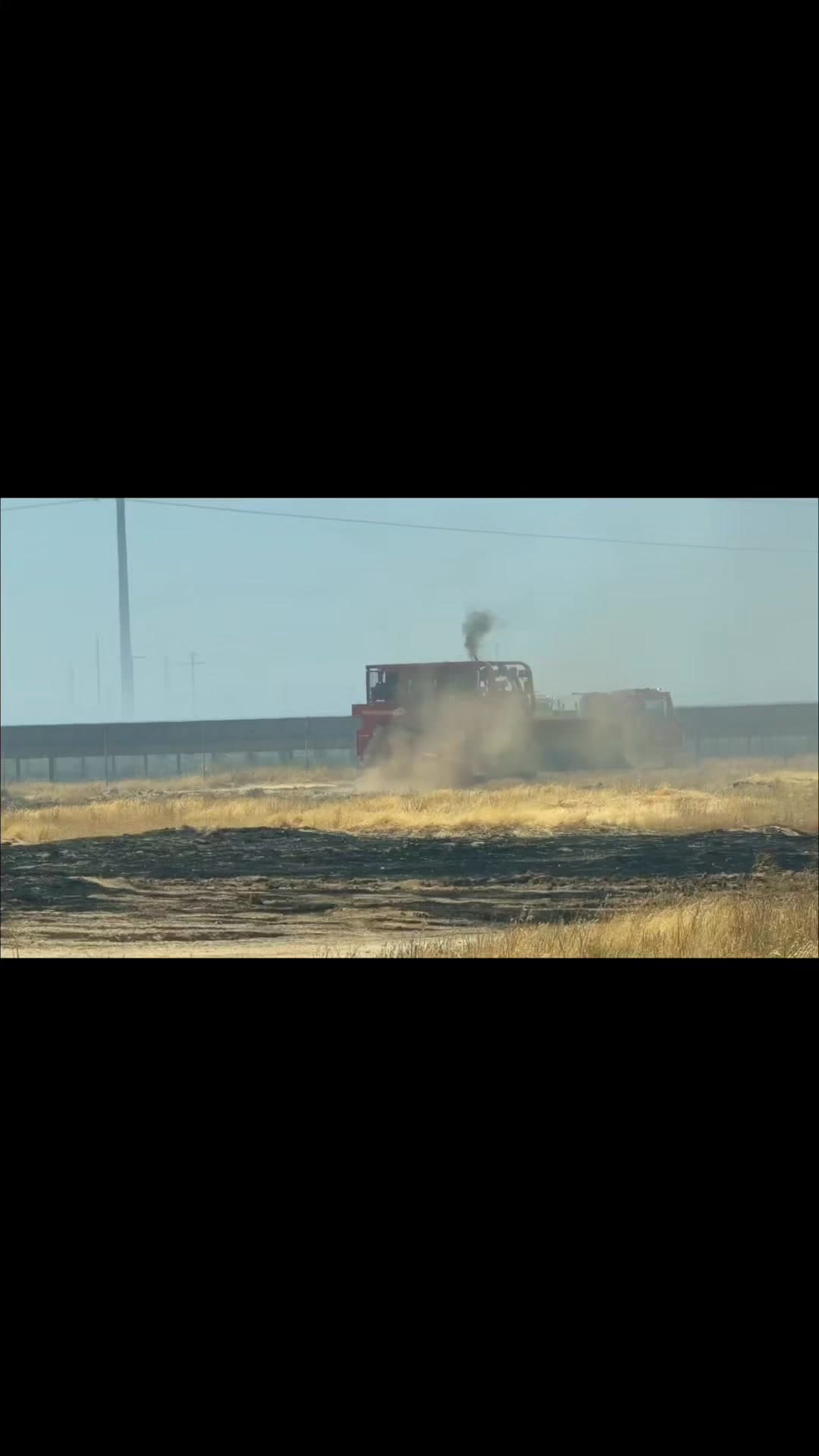 Crews remain on scene during mop-up operations for the Corral Fire near...