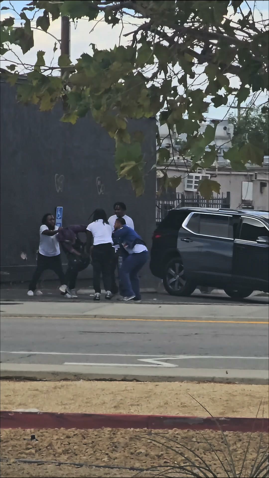 415.....10th Street East and Palmdale Boulevard at Sam's Liquor....group of male blacks...